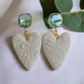 White embossed heart polymer clay earrings with aqua crystal gold studs