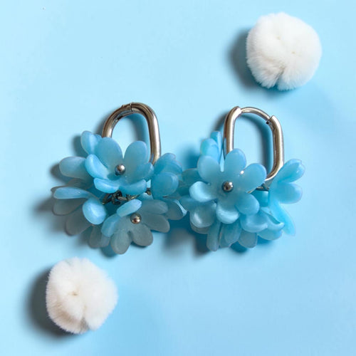Blue polymer clay blossom cluster earrings with silver-tone hoops and metallic flower centers